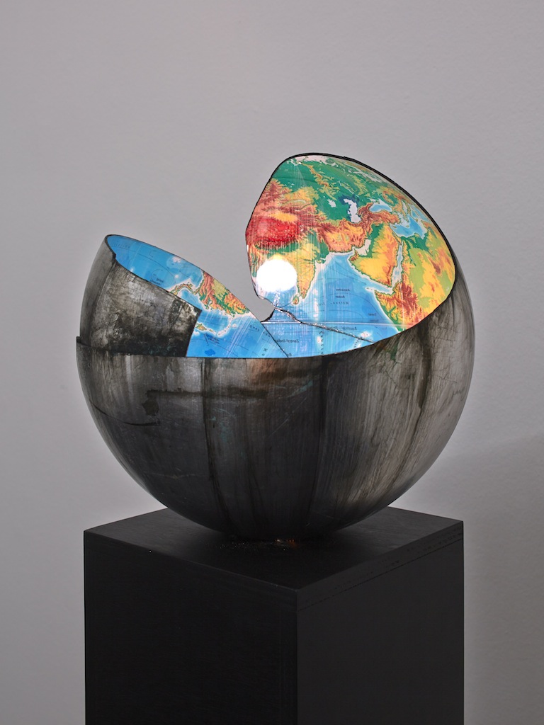 Danny McDonald, <i>Do You Believe In The Future: Part III</i>, 2010-2015, broken silver coated globe, green energy saving bulb, black wooden plinth, 154 x 32 x 32 cm