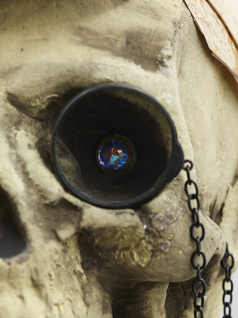 Danny McDonald, <i>The Speculator</i> (detail), 2015, antique top hat, styrofoam skull, wrestler legs, glass monocle, chain, crystal, broken globe, 73 x 40 x 30 cm